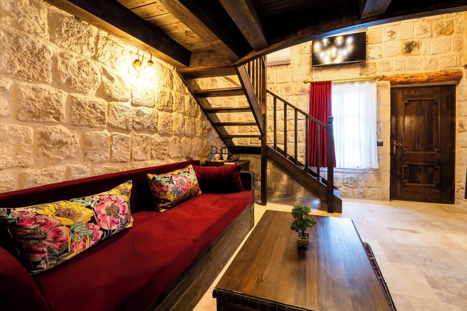 Signature Duplex | Living area | 80-cm flat-screen TV with satellite channels, books, heated floors