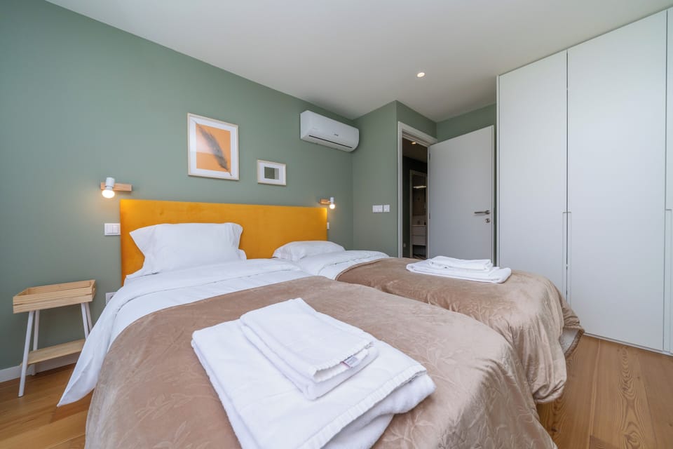 Family Apartment, Balcony, City View | Soundproofing, iron/ironing board, WiFi (free), bed sheets