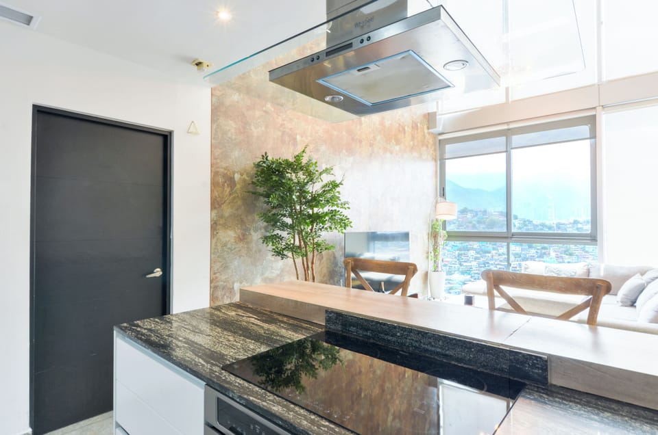 Luxury Suite | Private kitchen | Full-size fridge, microwave, oven, blender