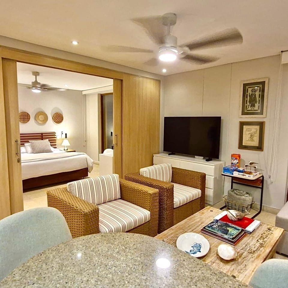 Apartment, City View | Living room | 50-inch flat-screen TV with digital channels