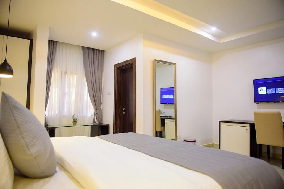 Deluxe Room, Balcony, City View | Desk, laptop workspace, blackout drapes, soundproofing