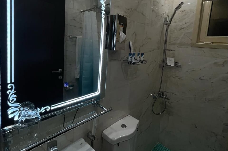 Hair dryer, slippers, towels, soap