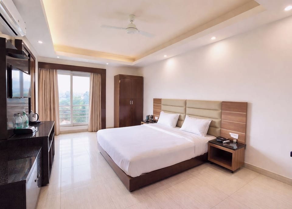 Premium bedding, desk, laptop workspace, soundproofing