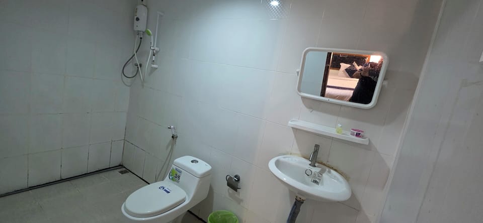 Standard Double Room | Bathroom | Shower, slippers, towels, soap