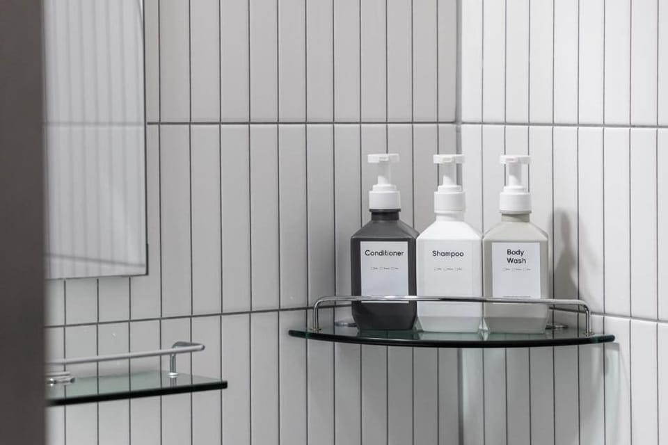 Single Room | Bathroom | Shower, hair dryer, slippers, towels