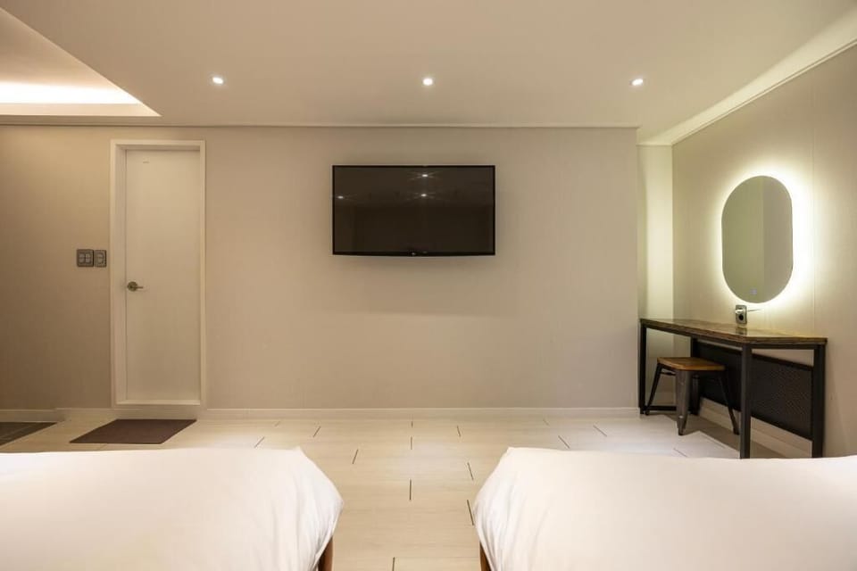 Family Room | Desk, laptop workspace, blackout drapes, iron/ironing board