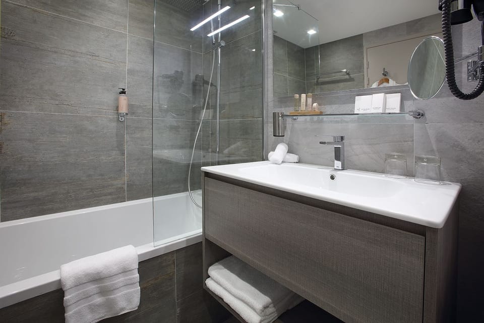 Rainfall showerhead, designer toiletries, hair dryer, bathrobes