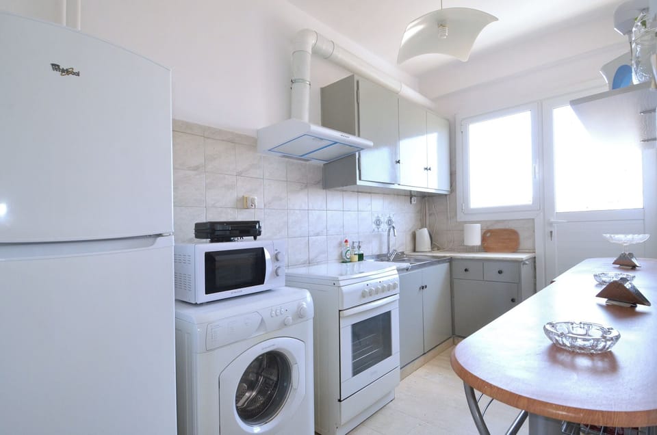 Apartment, Balcony, City View | Private kitchen | Full-size fridge, microwave, oven, stovetop