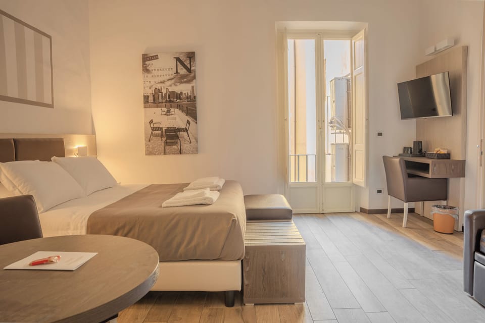 Comfort Quadruple Room, Balcony, Courtyard View | In-room safe, desk, free WiFi