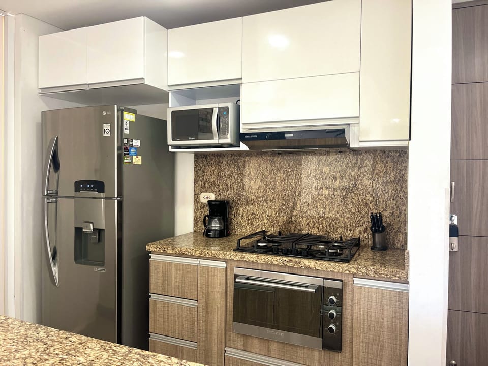 Apartment, Pool View | Private kitchen | Coffee/tea maker