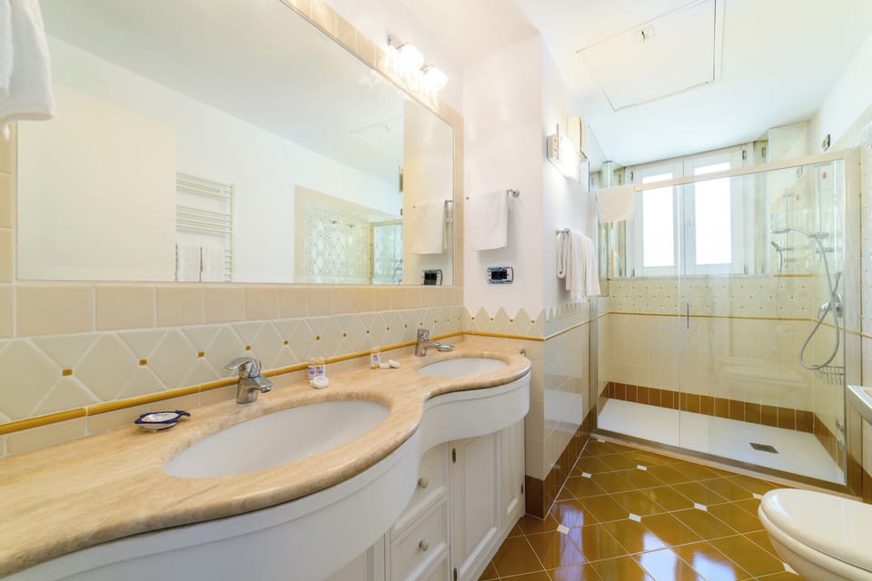 Family Triple Room, Balcony, Sea View | Bathroom | Shower, hair dryer, towels, soap