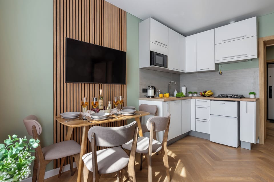 Superior Apartment, City View | Private kitchen | Griddle, cleaning supplies, paper towels, dining table