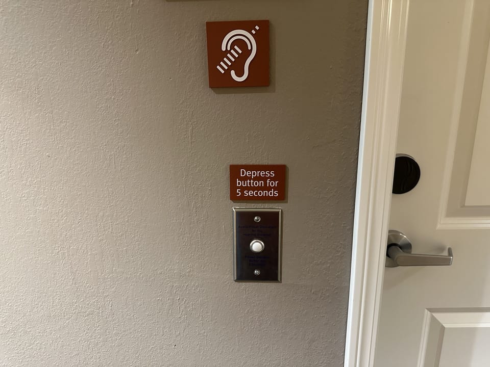 Premium bedding, laptop workspace, iron/ironing board