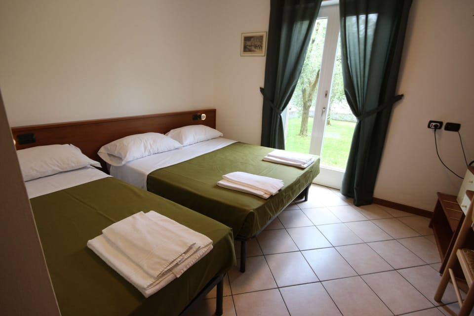 Classic Triple Room, Ground Floor | Blackout drapes, soundproofing, free WiFi