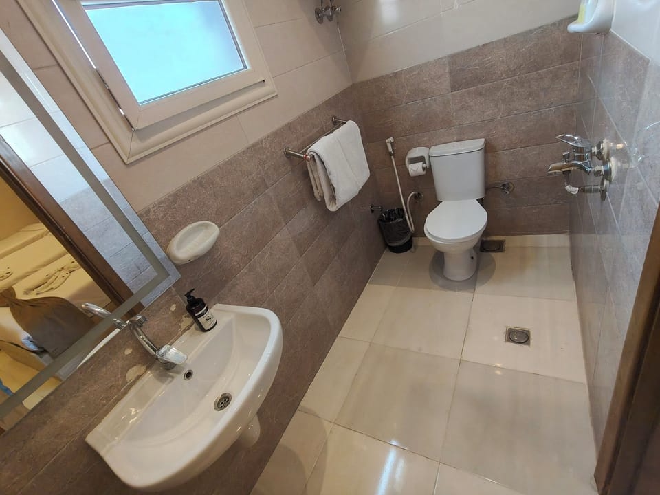 Triple Room, City View | Bathroom | Hair dryer, towels, soap, shampoo