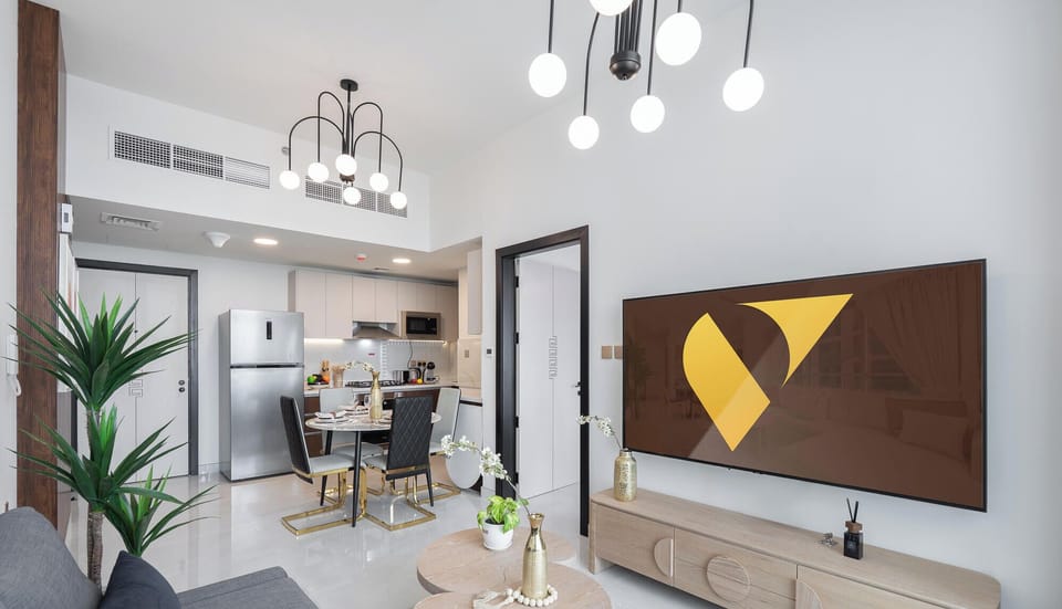 Deluxe Apartment | Living area | 65-inch Smart TV with cable channels