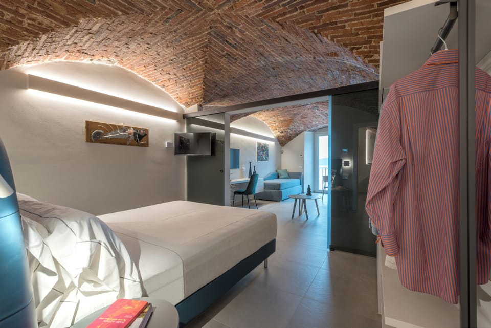 Superior Suite, Sea View | Minibar (some free items), in-room safe, desk, laptop workspace