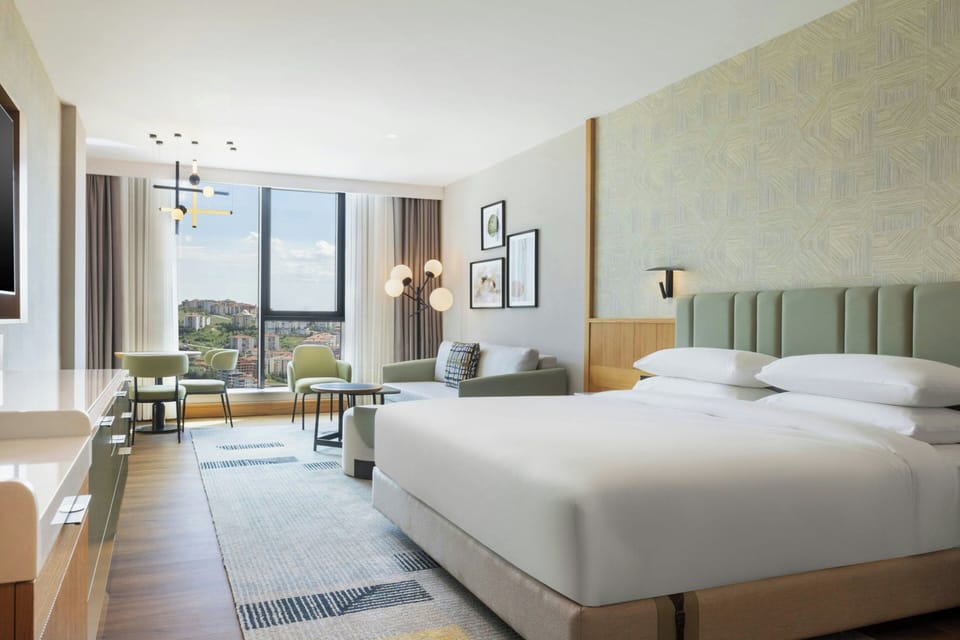Deluxe Room, 1 King Bed with Sofa bed, City View | Minibar, in-room safe, desk, laptop workspace