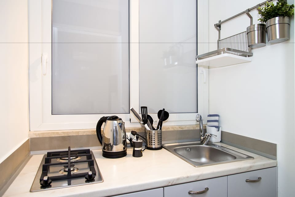 Suite executive, cucina, vista città , Edificio annesso | Private kitchenette | Espresso maker, coffee/tea maker, electric kettle