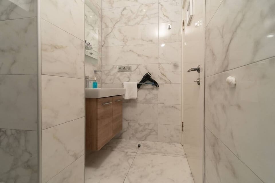 Exclusive Double Room, City View | Bathroom | Shower, hair dryer, towels, soap