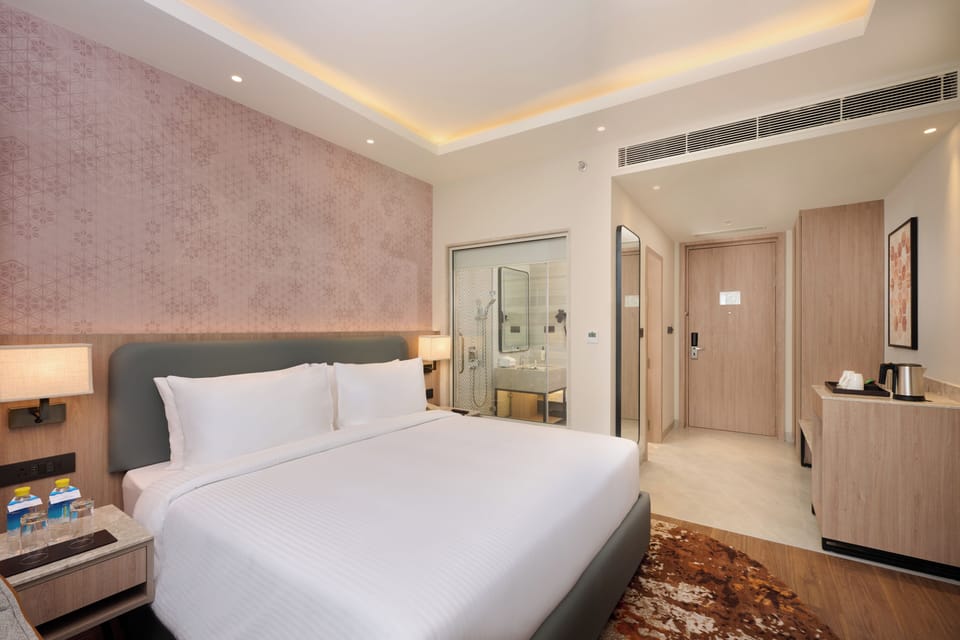 Deluxe Double Room | Minibar, blackout drapes, soundproofing, iron/ironing board