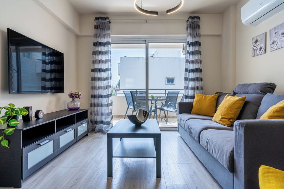 Apartment, 2 Bedrooms, Kitchen, City View | Living area | 50-inch Smart TV with digital channels, Netflix, streaming services