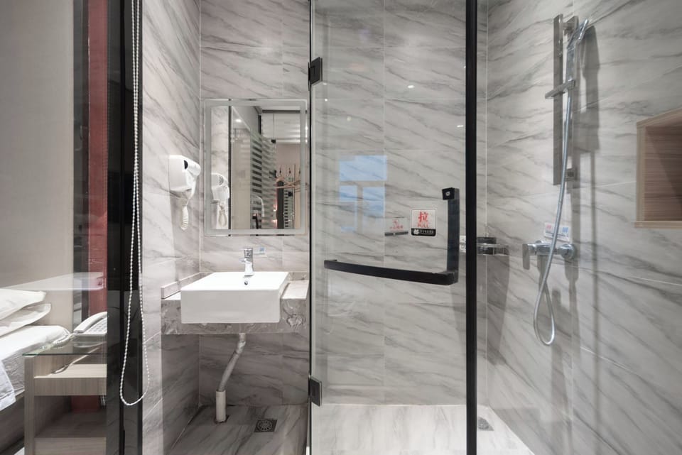 Shower, hair dryer, slippers, towels