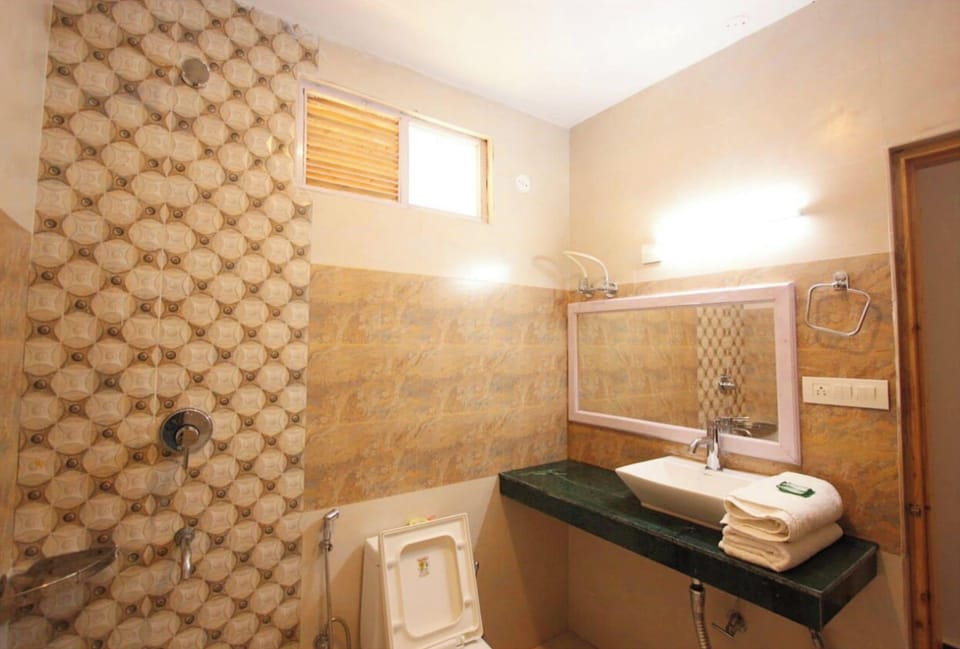 Shower, rainfall showerhead, slippers, towels