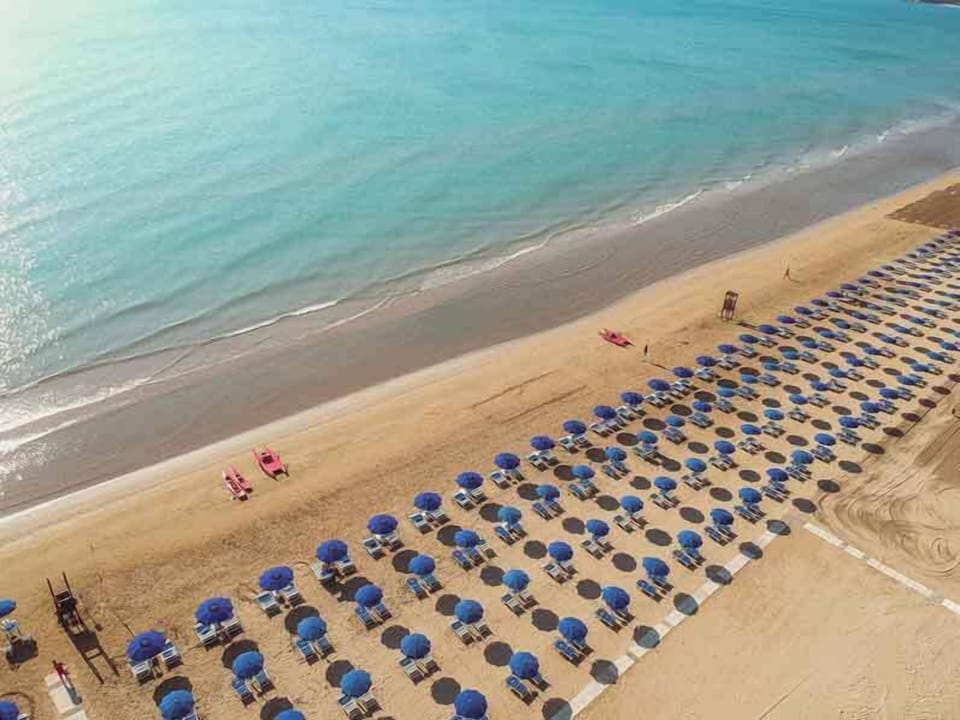 Private beach, white sand, sun loungers, beach umbrellas