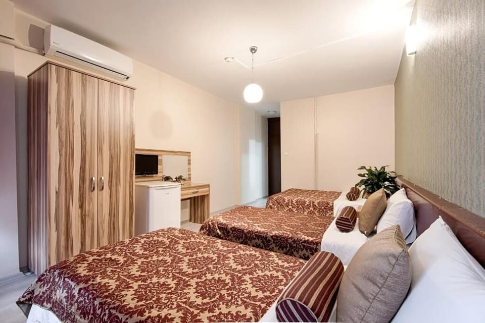 Triple Room, City View | In-room safe, blackout drapes, soundproofing, iron/ironing board