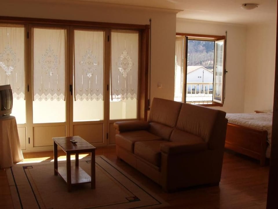 Standard Apartment, City View | Living area | TV