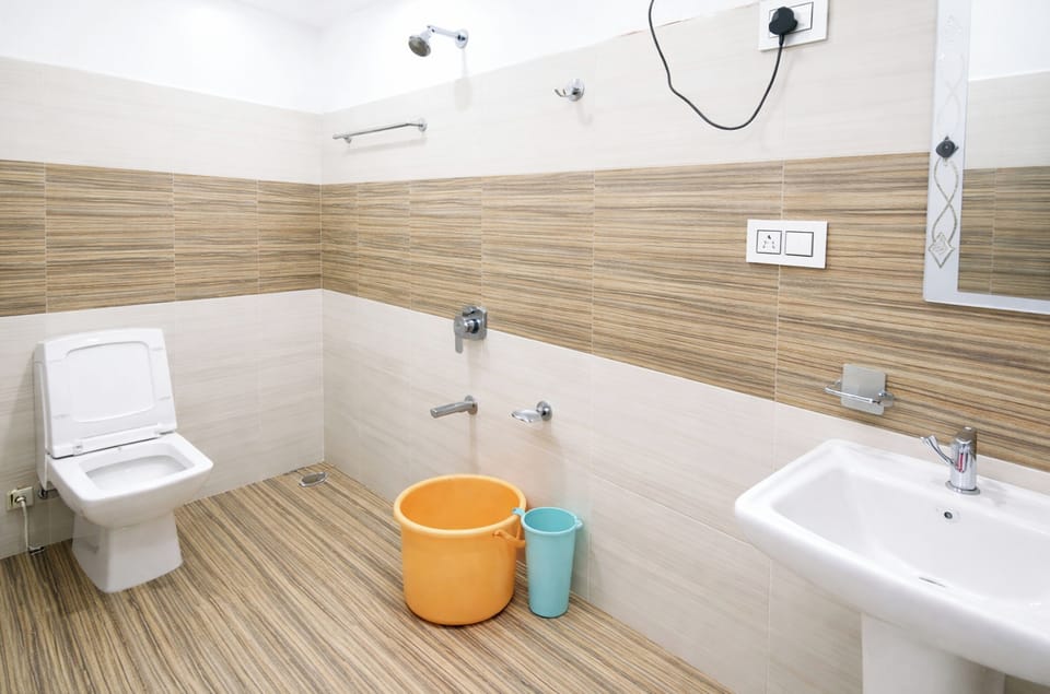 Shower, rainfall showerhead, slippers, towels