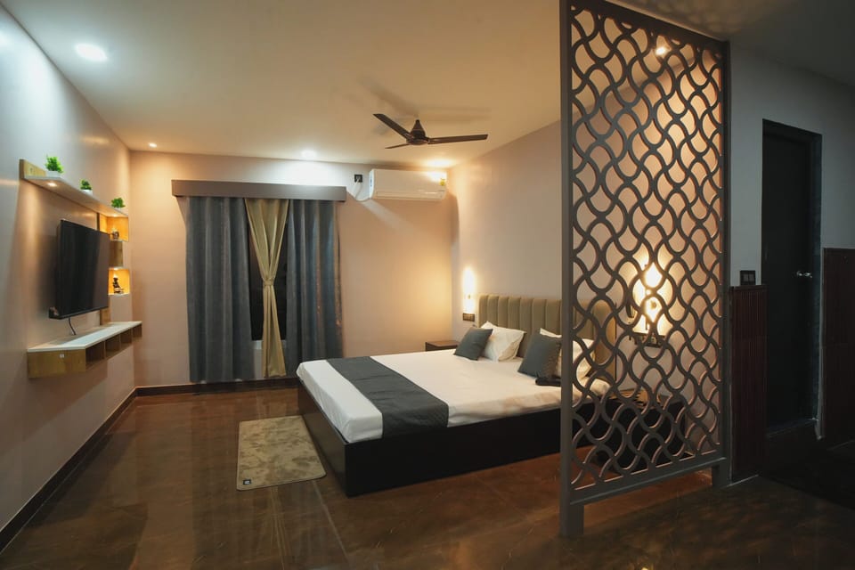 Luxury Studio Suite, City View | Desk, laptop workspace, blackout drapes, iron/ironing board