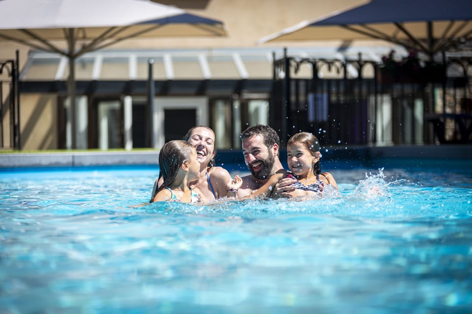 Seasonal outdoor pool, open 10:30 AM to 6:00 PM, pool umbrellas