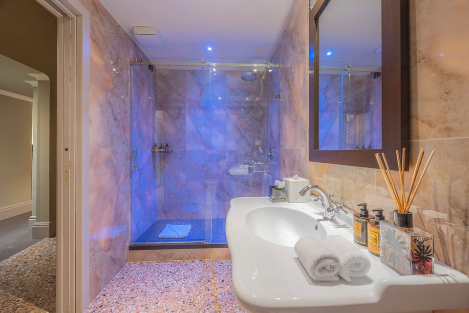 Grand Suite, 1 King Bed | Bathroom | Free toiletries, slippers, towels, soap