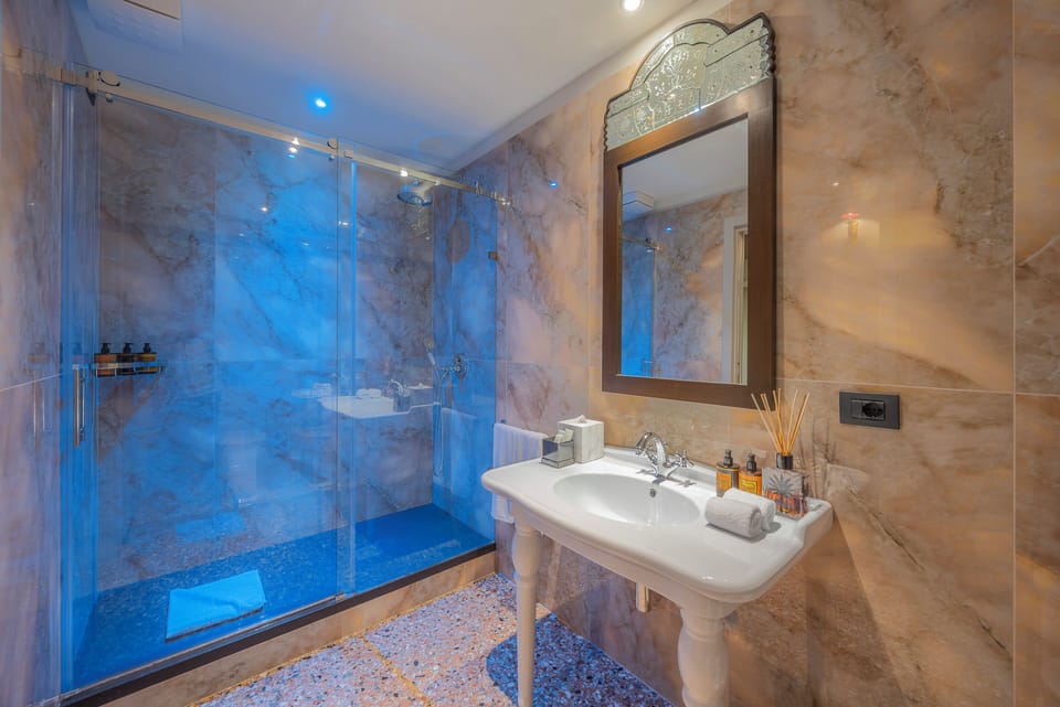 Grand Suite, 1 King Bed | Bathroom | Free toiletries, slippers, towels, soap