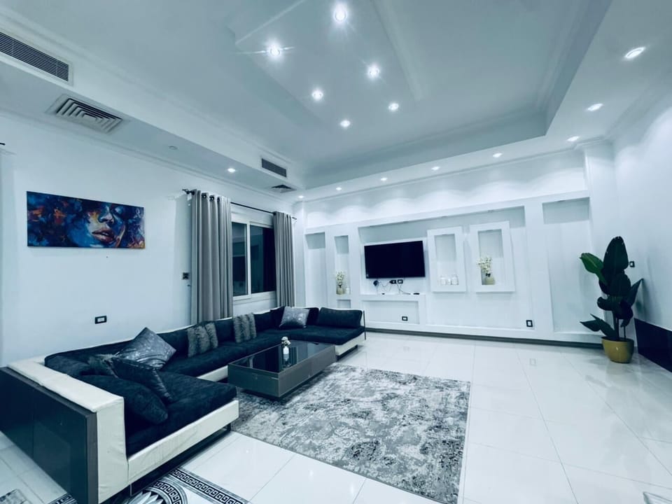Deluxe Villa, Garden View | Living area | 65-inch Smart TV with digital channels