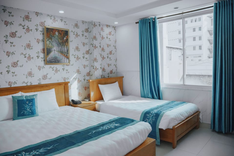 Family Triple Room, 2 Bedrooms, City View | Desk, iron/ironing board, free WiFi