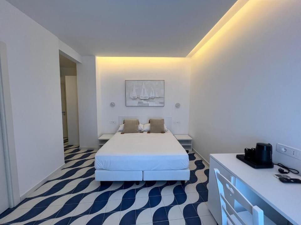 Deluxe Room, Sea View | In-room safe, blackout drapes, iron/ironing board (on request)