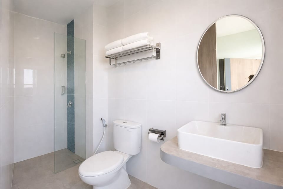 Shower, rainfall showerhead, bidet, towels