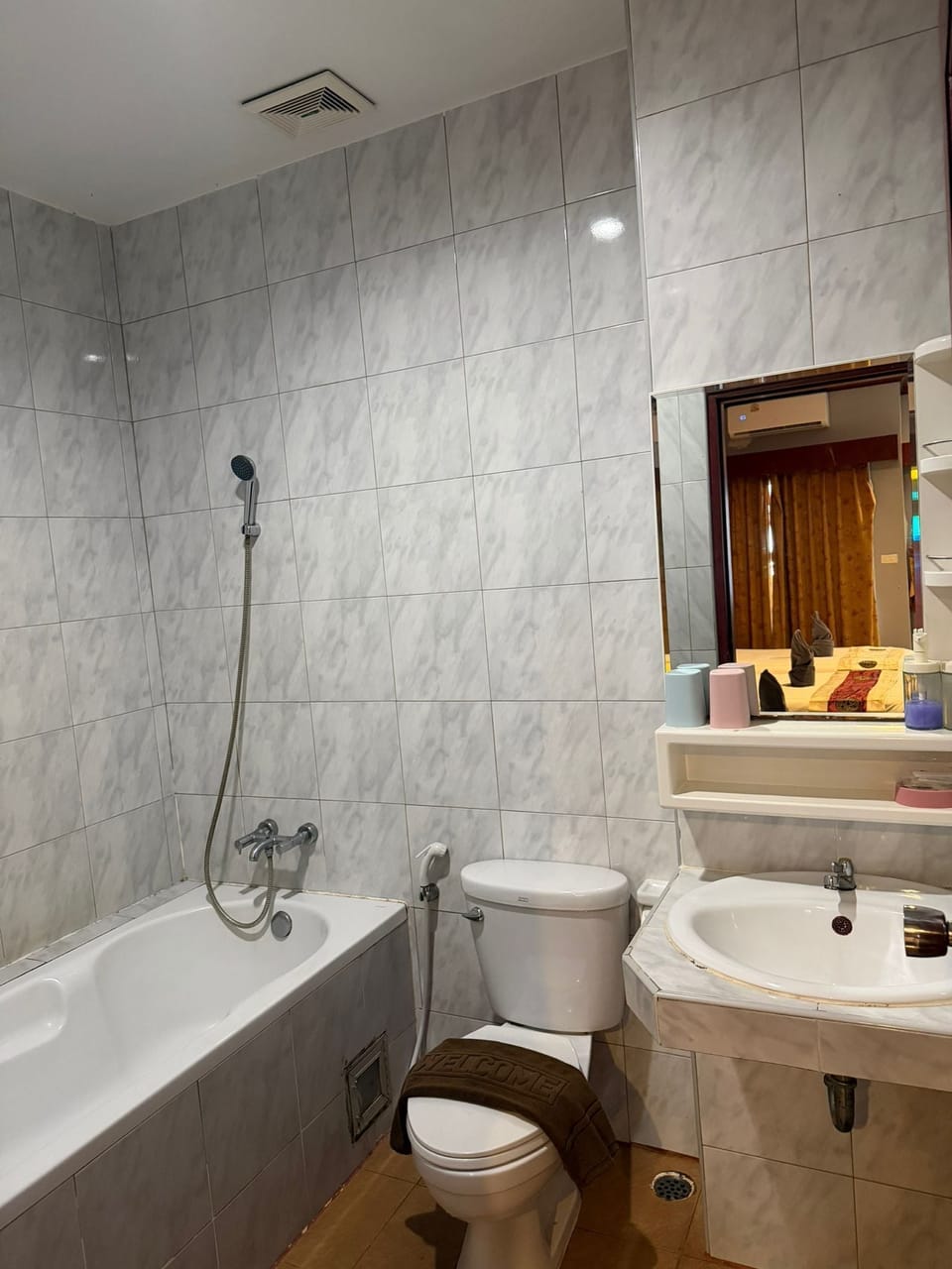 Family Studio, Multiple Beds, Balcony, City View | Bathroom | Combined shower/tub, hair dryer, bidet, towels