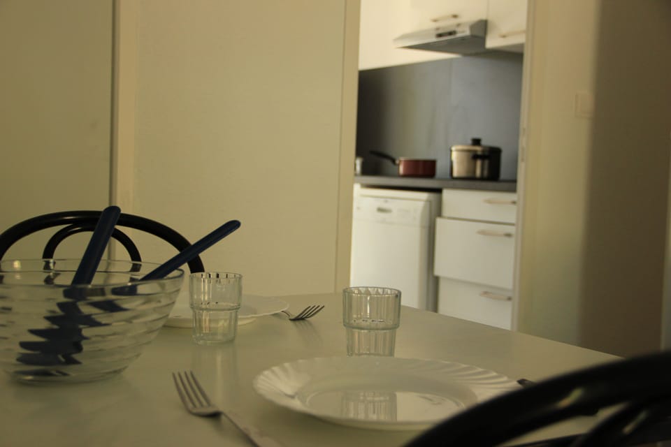 Apartment | Living area | 17-inch flat-screen TV with cable channels