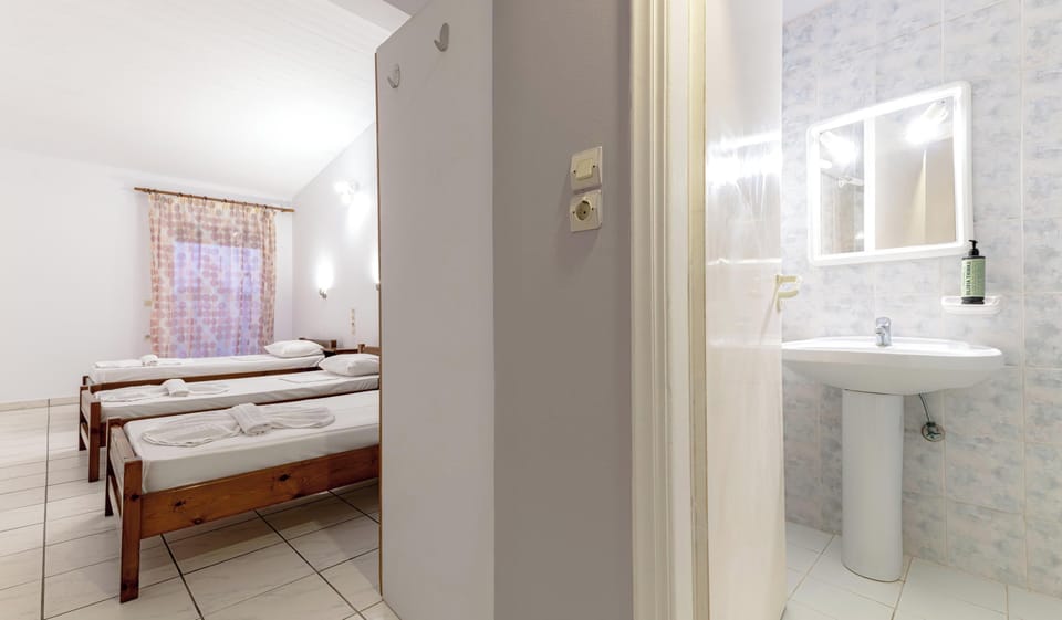 Triple Room, Balcony | Iron/ironing board, free WiFi, bed sheets
