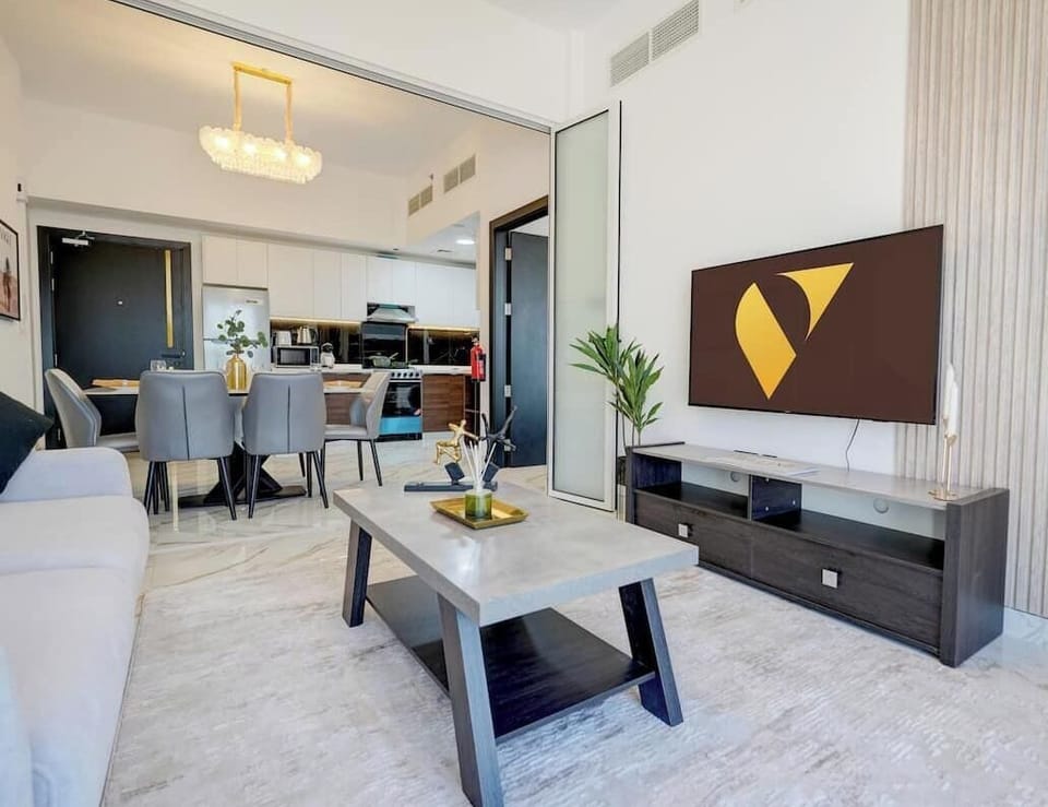 Luxury Apartment, Balcony, City View | Living area | 65-inch Smart TV with cable channels