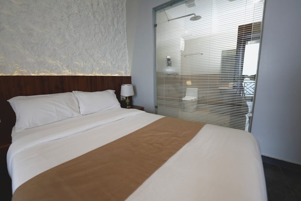 Premium bedding, desk, laptop workspace, WiFi (free)