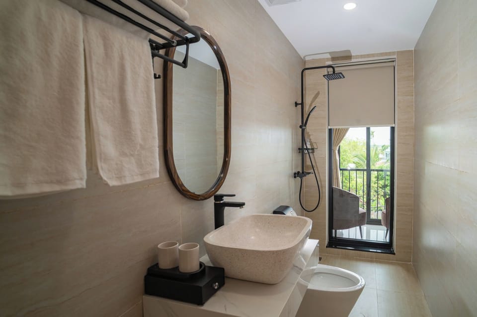 Deluxe Quadruple Room, Balcony | Bathroom | Shower, hair dryer, towels, soap