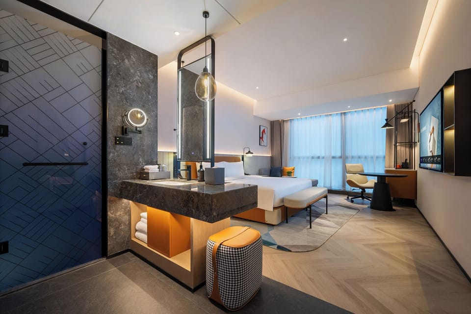 Premium bedding, memory foam beds, free minibar items, desk