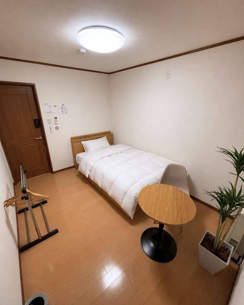 Basic Single Room | Blackout drapes, bed sheets