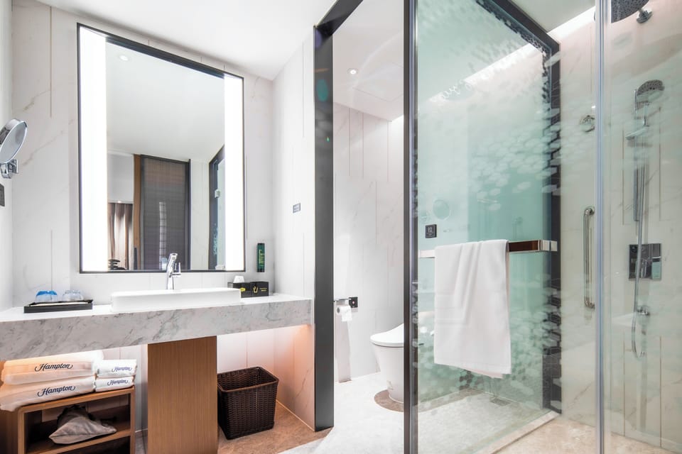 Classic Studio Suite, City View | Bathroom | Hair dryer, slippers, towels, soap