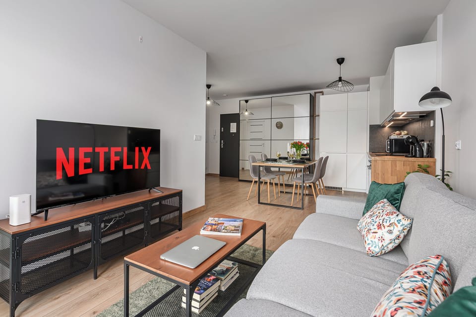 Comfort Apartment, Patio, Courtyard View | Living area | 40-inch LCD TV with digital channels